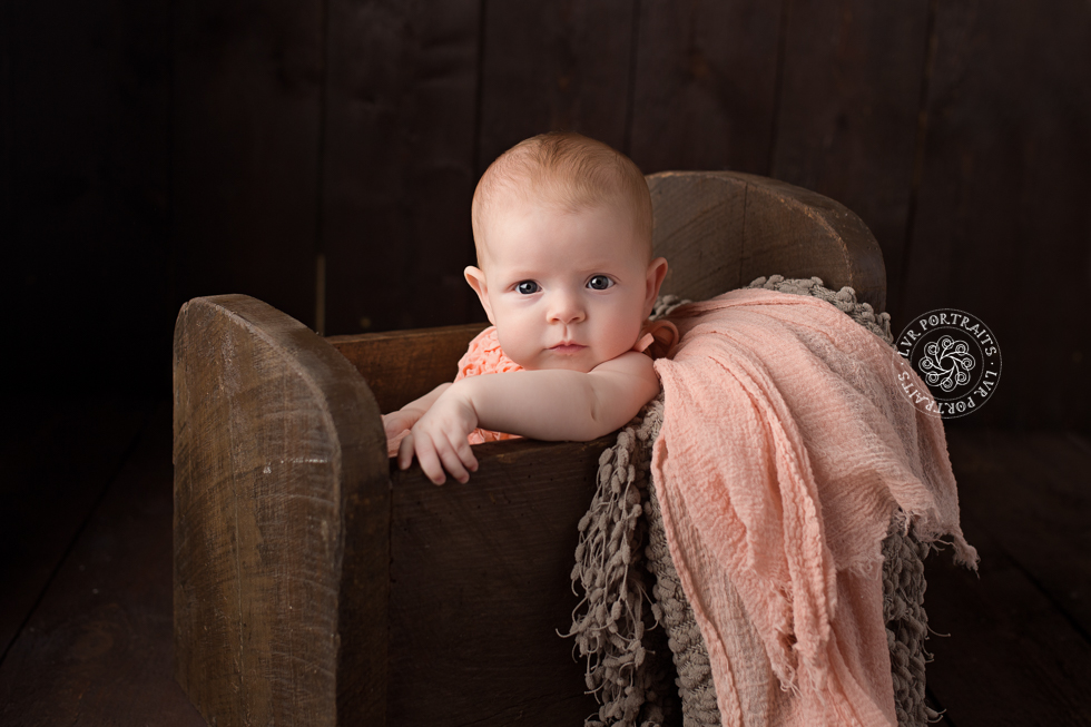 Lancaster Baby Photographer - baby in wood bed
