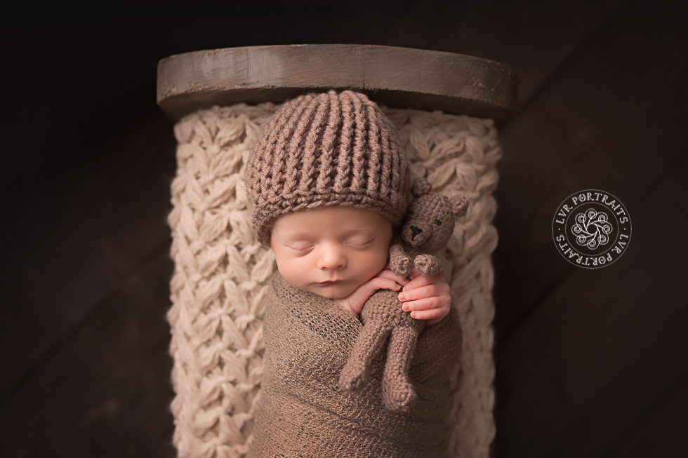Newborn photography, Lancaster PA, baby boy in wood bed