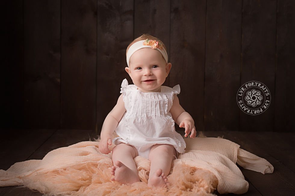 baby photographer, lancaster pa, baby girl in white dress, dark wood background