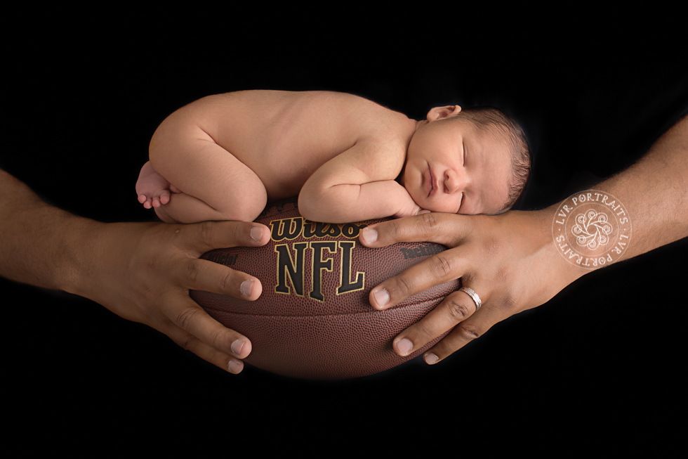Lancaster newborn photography, baby boy with football, dad's hands