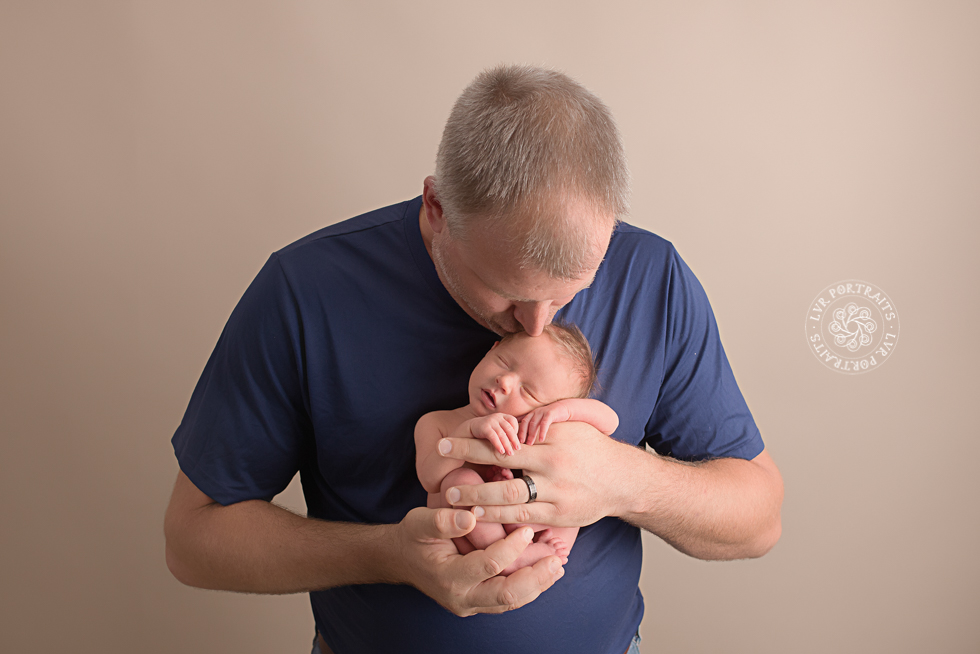 Newborn photography session, lancaster PA, newborn boy, dad kissing head