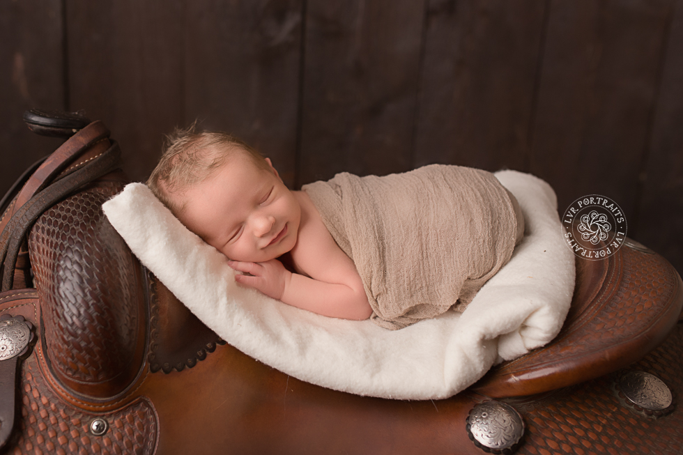 Newborn photography session, lancaster PA, newborn boy, horse saddle,