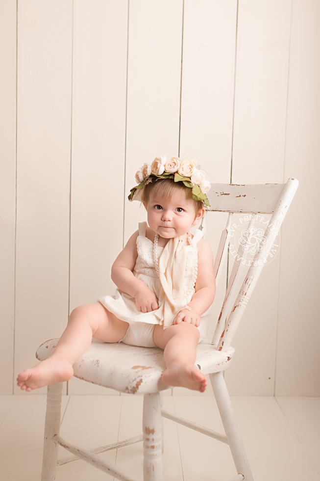 One-year cake smash, baby girl on chair