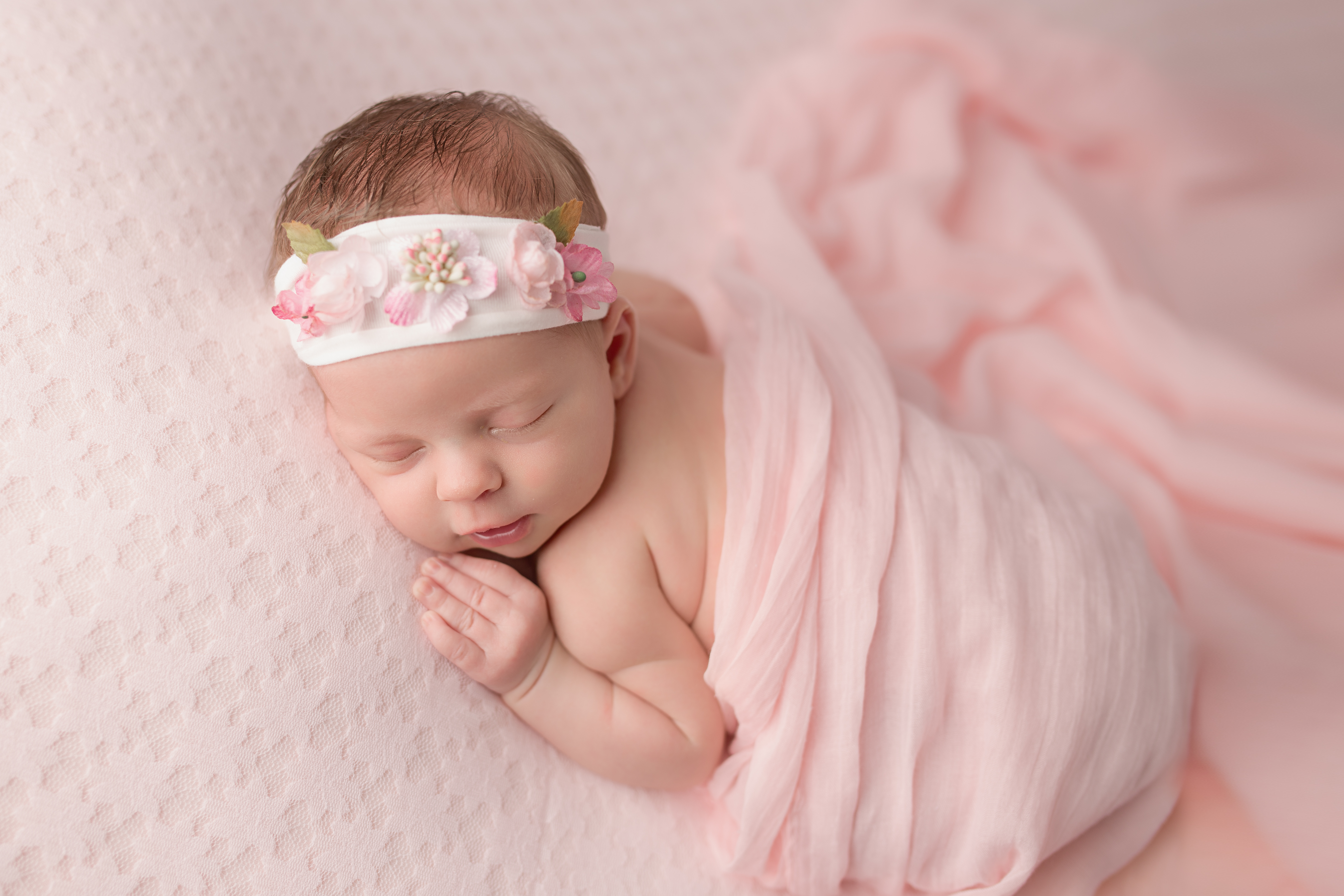 Lancaster-newborn-photography-studio, baby girl on beanbag, pink wrap & headband